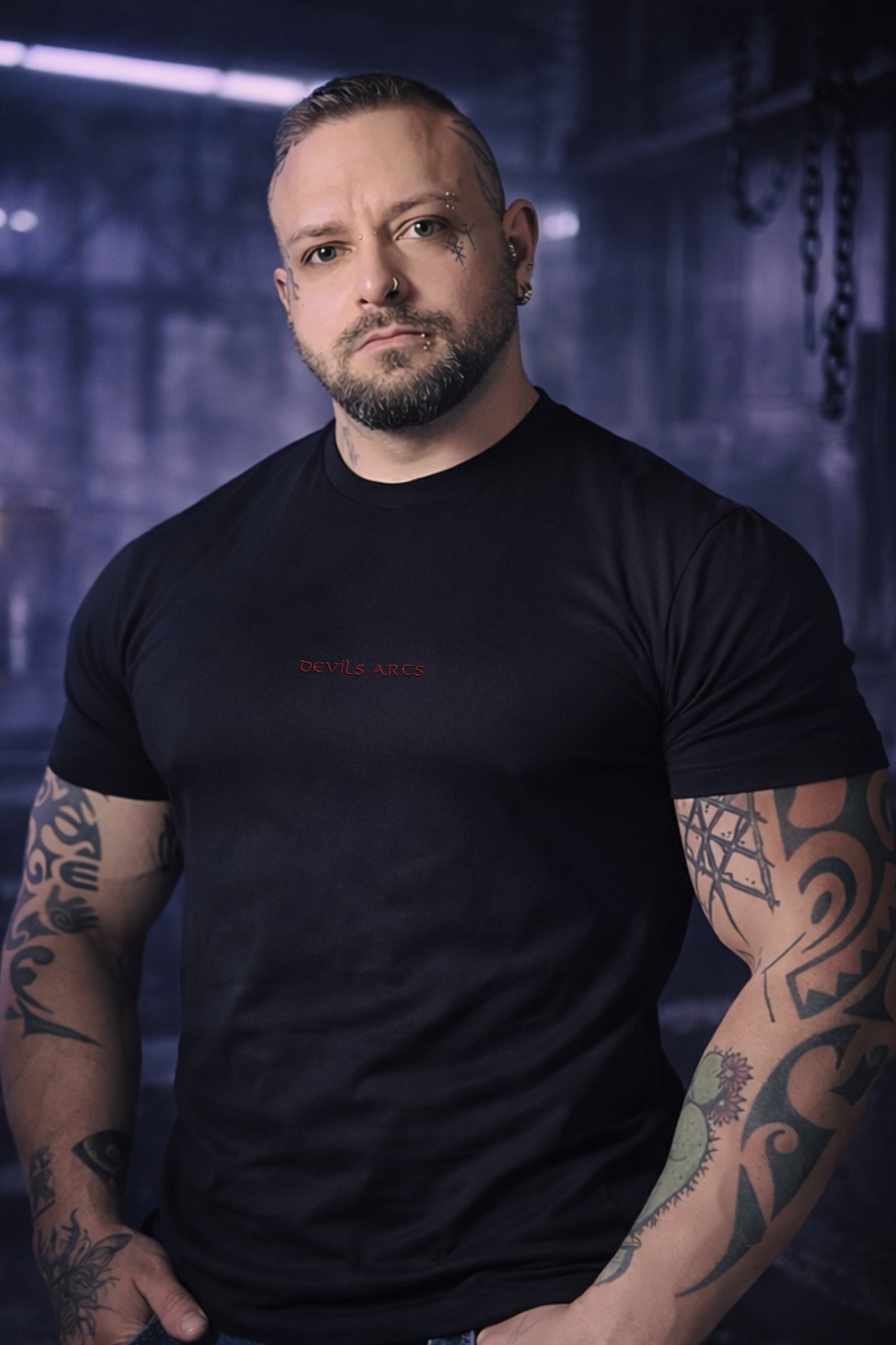 tattooed male model wearing black DEVILS ARTS embroidered logo t-shirt dark tattoo streetwear