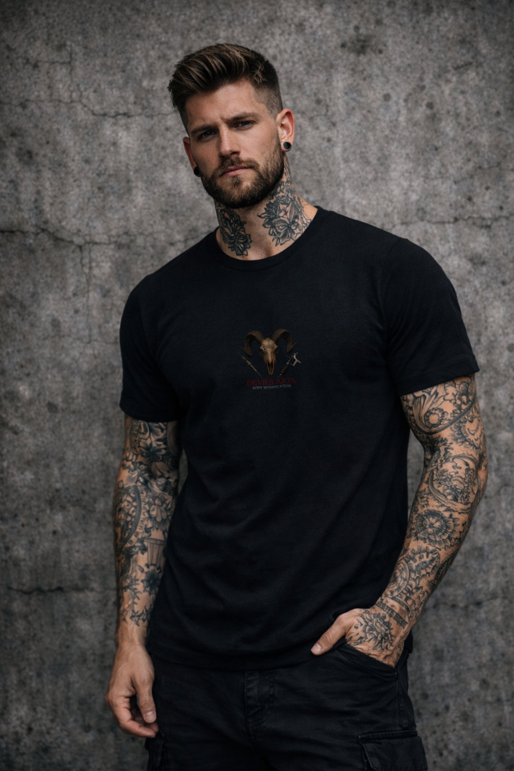 tattooed man wearing DEVILS-ARTS RAW LOGO black tattoo culture shirt with ram skull chest print