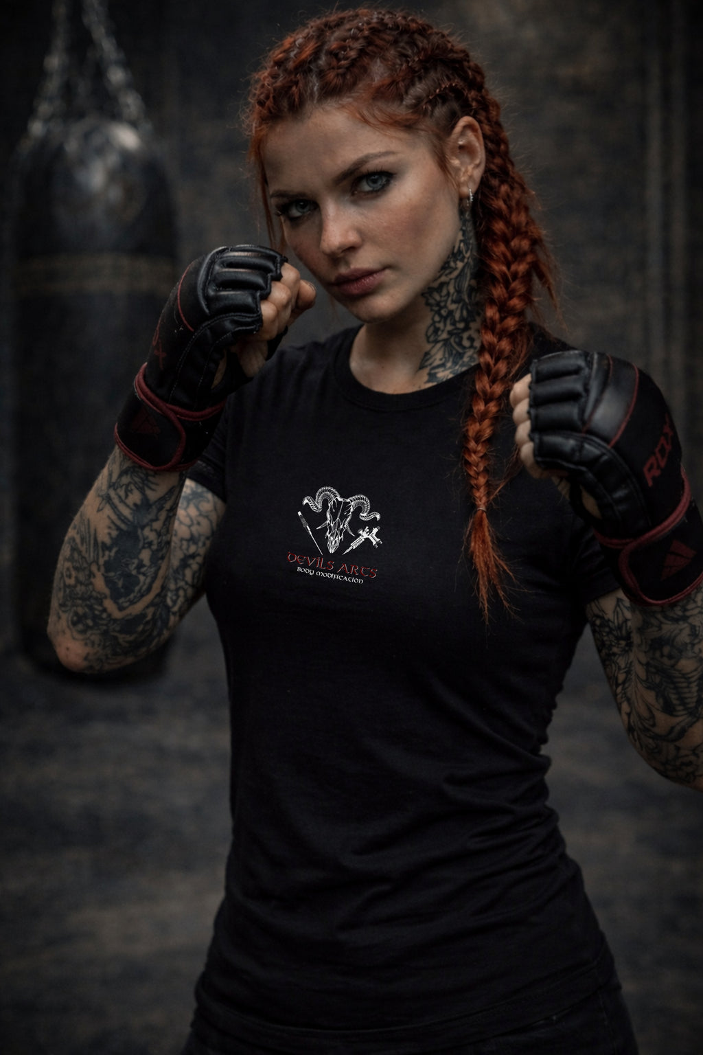tattooed female model wearing black DEVILS-ARTS skull logo t-shirt dark tattoo streetwear