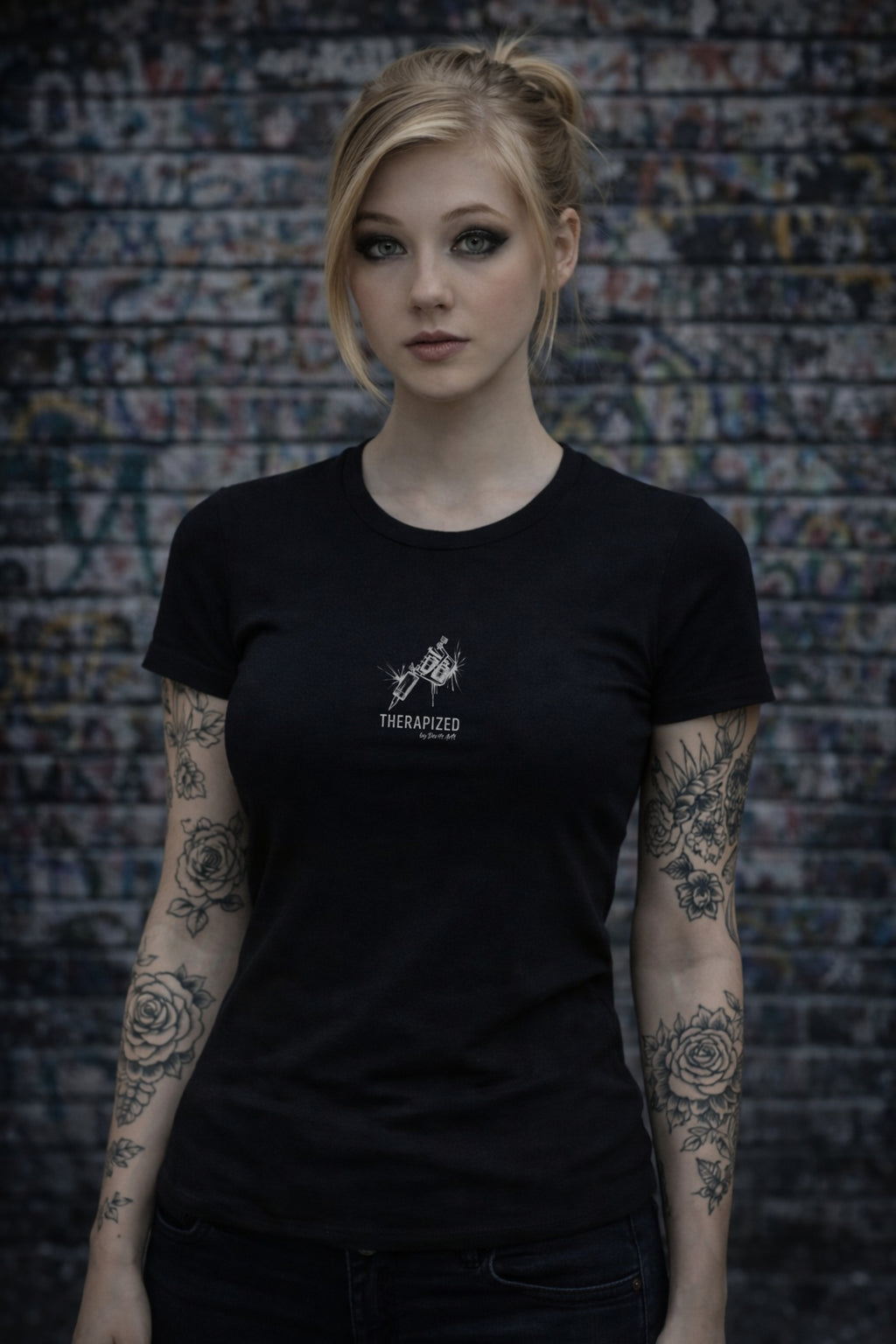 tattooed woman wearing black tattoo culture t-shirt with therapized tattoo machine design