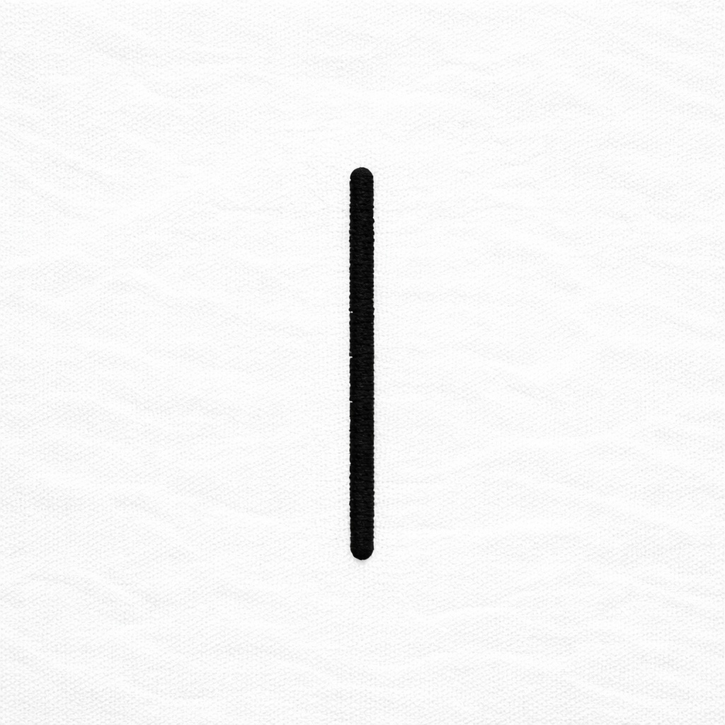 white t-shirt close-up of minimal vertical bar embroidered logo tattoo streetwear